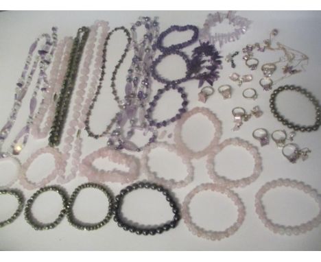 A selection of costume jewellery to include amethyst silver set jewellery 