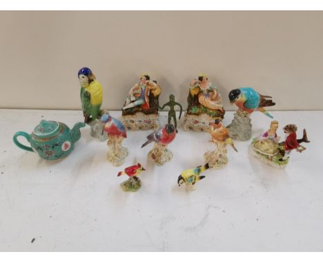 Porcelain to include three Royal Worcester birds, two Tuscan porcelain parrots, a pair of 19th century figures resting on log