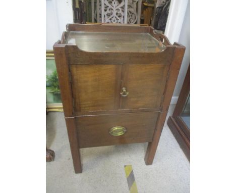 A Georgian mahogany commode with two doors with slide out drawer below 
