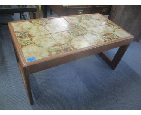A vintage tile topped coffee table 40cm h x 85cm w 