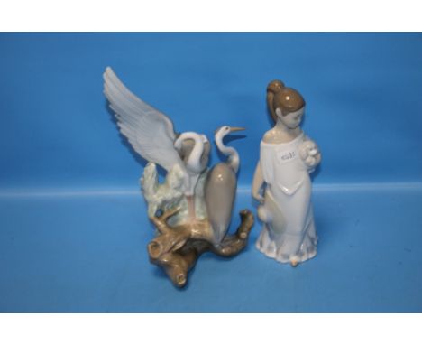 A NAO FIGURINE AND A HERON GROUP