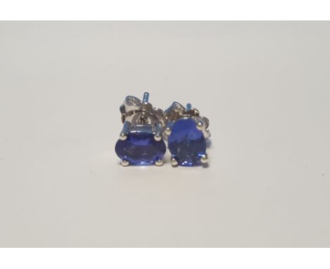 A PAIR OF TANZANITE SILVER STUDS
