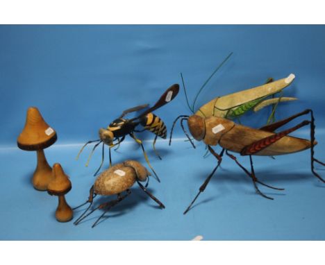 A COLLECTION OF WOOD AND METAL INSECTS TO INCLUDE A GRASSHOPPER, WASP, BEETLE ETC. Condition Report:Wasp - L 24 cm , metal wi