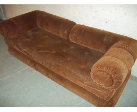 A BROWN SOFA BED