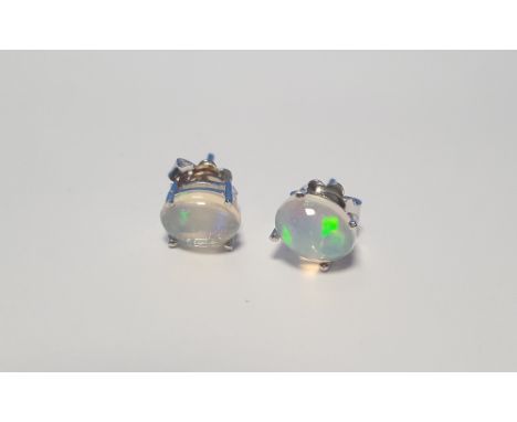 A PAIR OF CABOCHON WHITE OPAL SILVER STUDS