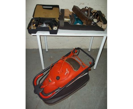 A FLYMO MOWER AND A SELECTION OF TOOLS