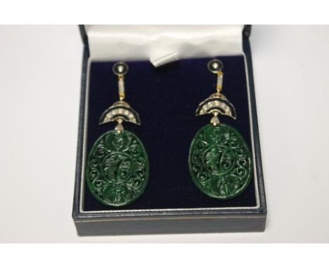 A PAIR OF OVAL SHAPED PATTERNED JADE DROP EARRINGS SET WITH DIAMONDS AND INLAID WITH BLACK ENAMEL, BUTTERFLY BACKS, BOXED