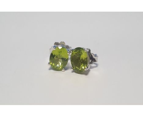 A PAIR OF PERIDOT SILVER STUDS