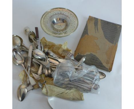 A collection of silver plated items including flatware and a pierced dish