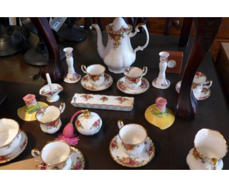 A Royal Albert Old Country Rose tea service, a pair of candlesticks and a Wedgwood travel clock 