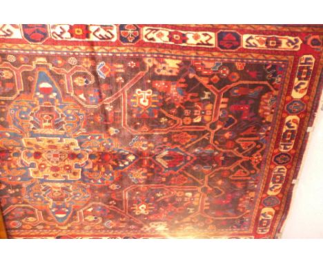 A fine North West Persian Nahawand carpet 295 x 155cm central eagle Kazak motifs with repeating Animal motifs within stylised
