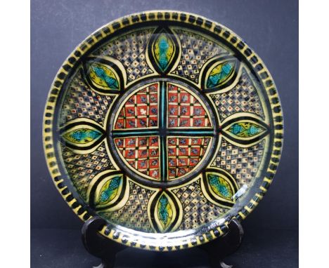 A Persian glazed ceramic dish, with geometric decoration, dated and marked to base, H.4.5cm Diameter 26cm 