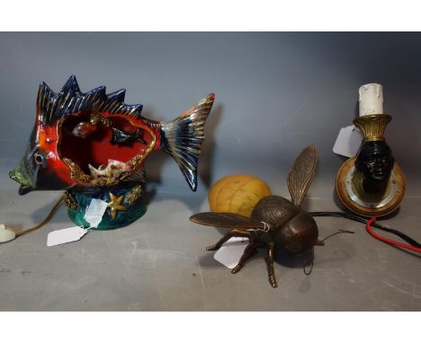 Three vintage lamps to include a metal and glass bee, a ceramic fish and a wall light bust 