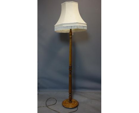 A vintage oak standard lamp, with shade, H.168cm 