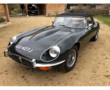 A 1971 E-type Jaguar V12 series III roadster, HGU 427, automatic transmission, finished in British racing green, with a tan i