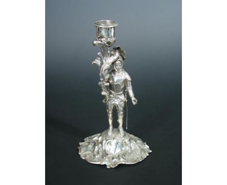 A silver candlestick in the form of a standing knight in full armour, London 1845, 19cm (7in)  Light to medium rubbing, overa