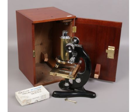 Beck of London model 47 brass and chrome microscope in fitted mahogany case. complete with two 25mm x 10mm eyepiece lenses an