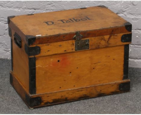 A twin handle metal bound part camphor wood trunk, stencilled D. Talbot. 