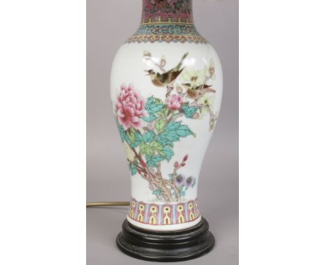 A oriental ceramic table lamp decorated with birds and flowers. 