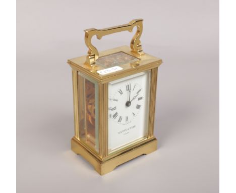 A Mappin &amp; Webb carriage clock with open top escapement and Roman numeral markers. 