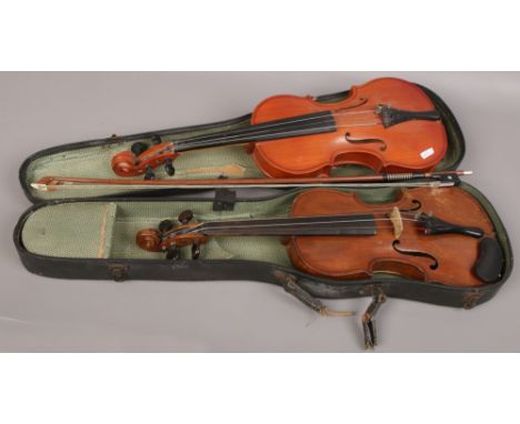 A cased vintage German violin and bow (33cm) along with a Russian violin (35cm) both two piece backs. 