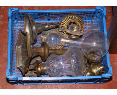 A box of oil lamp parts to include shades, fonts, bases etc. 