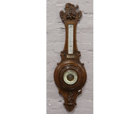 A carved oak banjo wall barometer with silver presentation plaque Mr &amp; Mrs A.D. Blackburn, Cashmere Works, assayed Birmin