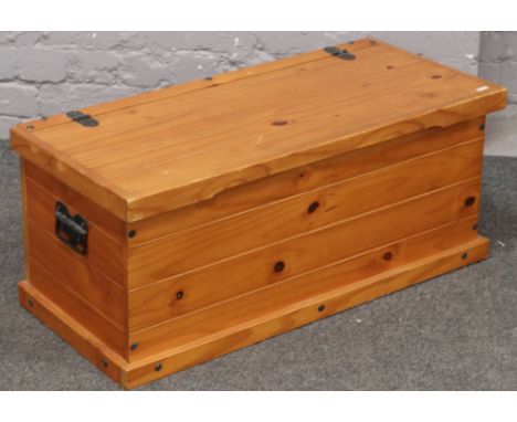 A stained pine twin handle trunk. 