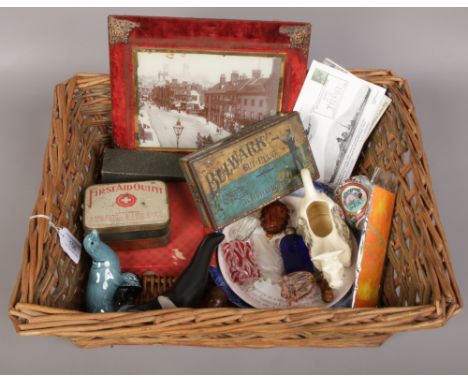 A basket of miscellaneous to include glass scent bottles, Poole, tins etc. 