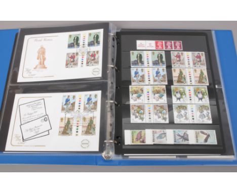 An album of first day covers and Mint stamps to include traffic light gutter pairs. 