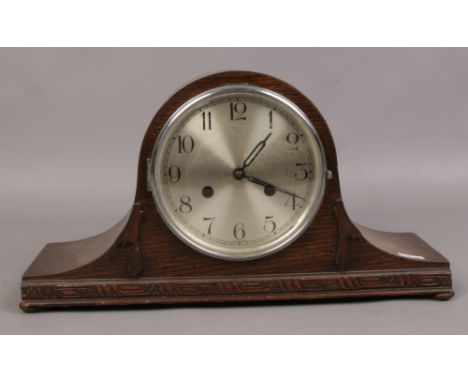 A dome shape oak mantle clock. 