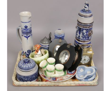 A tray of collectables including German stoneware, Davidson glass, Hummel figures, quartz carriage clock and portrait miniatu