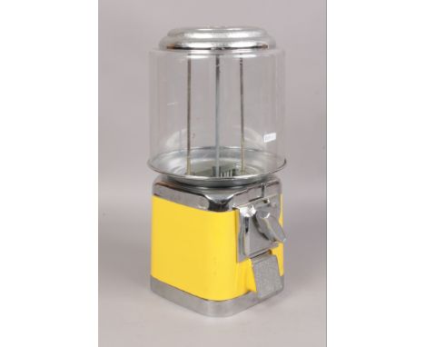 A vintage metal bubble gum machine. 