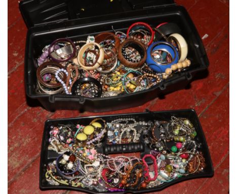 A tool box containing costume jewellery including bangles, beads, etc. 