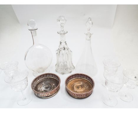 Collection of three 19th century glass decanters, pair of silver plated bottle coasters and 5 glasses   Condition - decanters