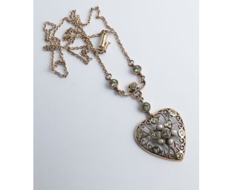 Edwardian design split pearl and peridot heart shaped pendant necklace, on peridot set suspension bar and gold chain.