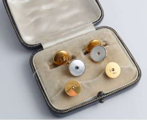 Pair of gold and mother of pearl circular cufflinks. With matching shirt studs. In fitted case, stamped to reverse 9ct & 18ct