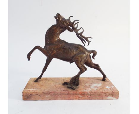 Spelter figure of red deer stag shot with an arrow on rouge marble base