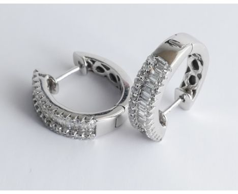 Pair of 18ct white gold baguette and brilliant cut diamond set half hoop earrings (matching previous lot)  In excellent condi