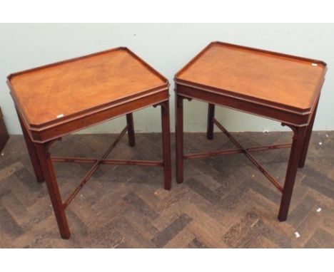 A pair of mahogany tray topped silver/lamp tables with cross-stretcher bases (matching the previous lot) by Arthur Brett & So