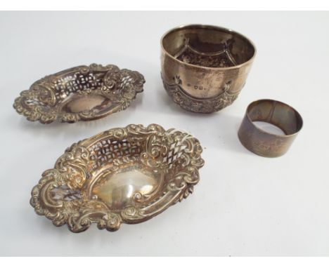 Pair of pierced silver sweet meat dishes, sugar basin and a napkin ring, four items in the lot the gross weight is 4.6 oz tro