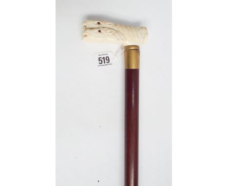 Hardwood walking cane, brass mounted with carved bone handle depicting four horses heads 