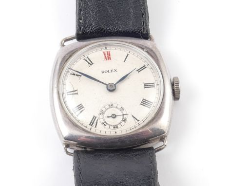 Vintage Rolex silver cased gents wristwatch on black leather strap.  Watch runs.