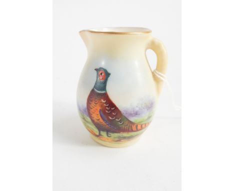 Small Locke Worcester blush ivory miniature jug hand painted with a pheasant, 6 cms tall.  No obvious sign of damage or repai