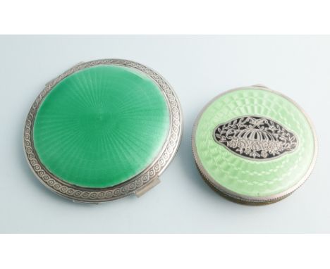 Vintage green enamel circular compact with inscription Joyce 1939, and another circular compact with green and black enamel l