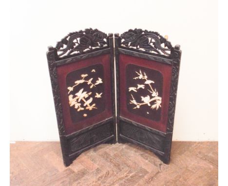 Chinese carved and lacquered bone decorated fire screen  Repair to top of fret on left hand panel