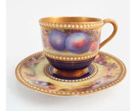 Royal Worcester cabinet cup and saucer, painted with fruit within royal blue border and jeweled gilded edge, indistinct signa