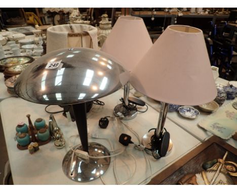 Pair of chrome table lamps with cylinder columns and a chrome mushroom head table lamp  CONDITION REPORT: The electrical item