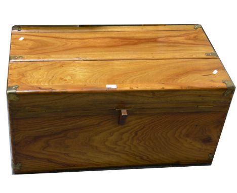 A hardwood campaign style banded trunk, applied gilt metal mounts, W87cm x D48cm x H42cm.