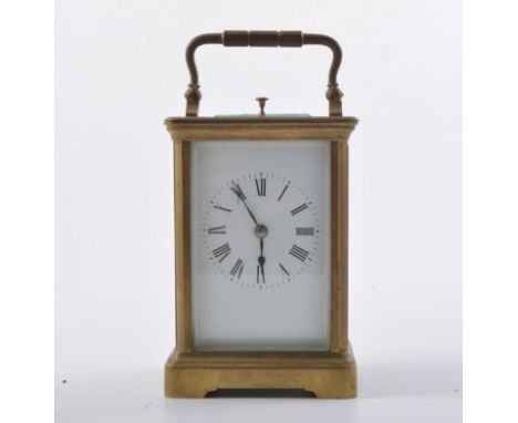 French brass cased repeating carriage clock, white enamalled dial, platform escapement, striking on a gong, 15cm.